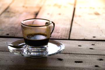 Close up coffee cup glass on wood table