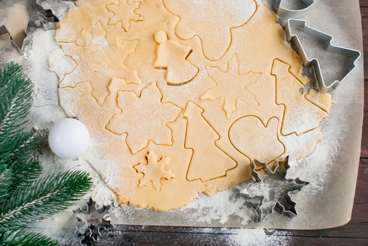 Cutting the gingerbread cookie dough for Christmas and New Year