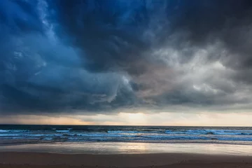 Zelfklevend Fotobehang Gathering storm on beach © Dmitry Rukhlenko
