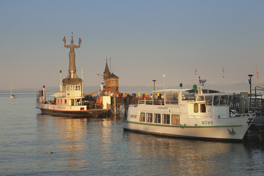 Statue of Imperia by Peter Lenk at the seaport, restaurant on a ship, Konstanz, Lake Constance, Baden-Wurttemberg, Germany