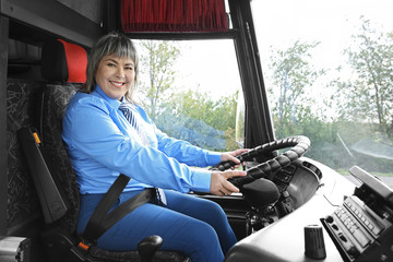 Female driver sitting in bus