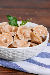 Boiled prepared homemade russian dumplings or pelmeni with beef meat