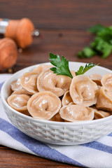 Boiled prepared homemade russian dumplings or pelmeni with beef meat