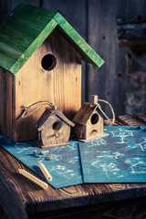 Cute home for birds in wooden workshop
