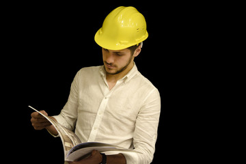 young construction engineer looking to project