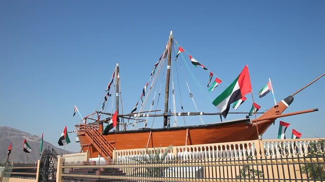 Historic wooden dhow ship at the corniche of Khorfakkan, Emirate of Sharjah, United Arab Emirates
