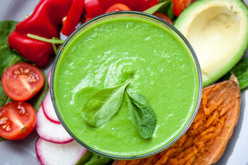 Salad with grilled vegetables: grilled sweet potatoes, tomatoes, avocados, spinach, tofu, pepper in a white bowl. Perfect for the detox diet or just a healthy meal.