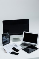 Computer, laptop, digital tablets, mobile phones and newspaper