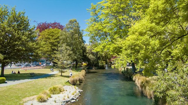 Christchurch New Zealand Avon River Flowing Through the City Center with Locals and Tourists Enjoying Good Weather in a Green Park Environment