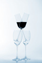 four glasses of wine on a light background