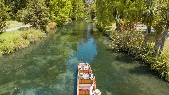 Christchurch New Zealand Gondola with Tourists on the Avon River through the Botanical Gardens on a Summers Day