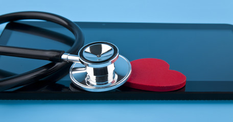 stethoscope, heart and tablet