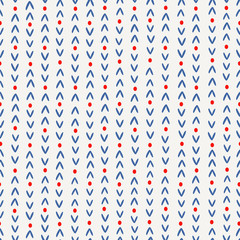 Abstract seamless pattern in blue and red on cream background.