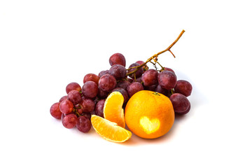 Grape on the white background. Fresh berry and mandarine