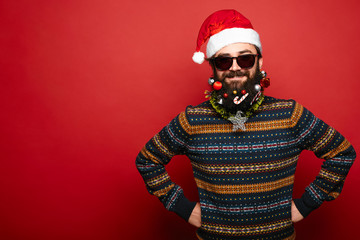 Fototapeta na wymiar man in Santa Claus hat and sunglasses