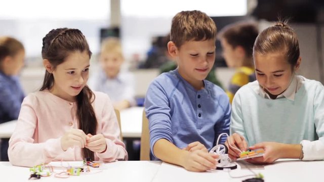 happy children learning at robotics school