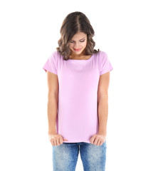 Young woman in blank color t-shirt on white background