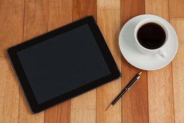 Fototapeta na wymiar Digital tablet with pen and cup of tea