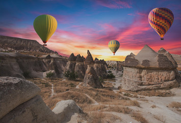 Hot air balloons flying over cappadocia.