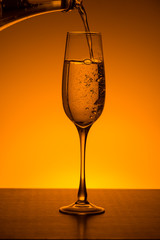 champagne glass on Orange gradient background