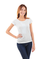 Fototapeta premium Young woman in blank t-shirt on white background