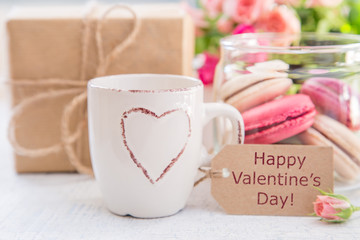 Morning coffee with flowers and macaroons. Mather's day Valentine' concept.