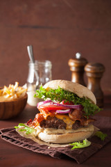 bacon cheese burger with beef patty tomato onion