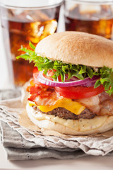 bacon cheese burger with beef patty tomato onion