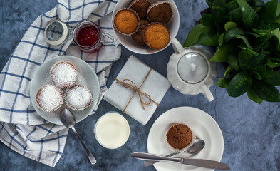 Bright and airy breakfast with muffin, berry jam and milk in glass. Top view