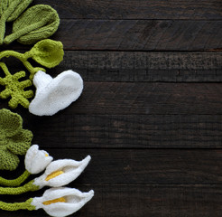  knitted green leaf and white flower background