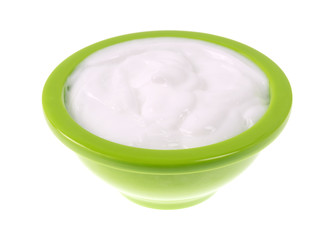 Bowl of vitamin E lotion on a white background