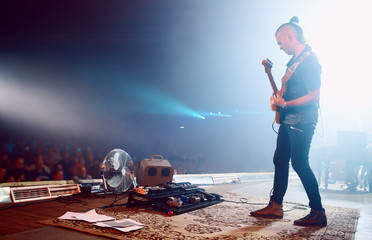 Guitarist performing on stage.