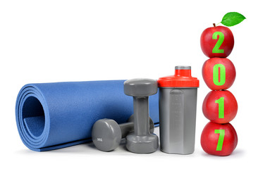Red apples, dumbbells and protein shaker isolated on white. Healthy resolutions for the New Year 2017