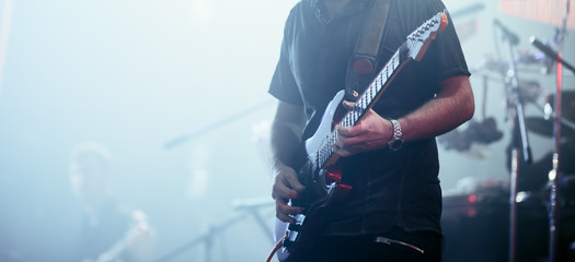 Guitarist performing on stage.