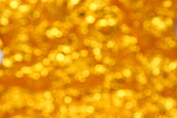 abstract golden bokeh circles for Christmas background.