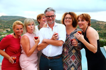womanizer/ macho man surrounded by beautiful women