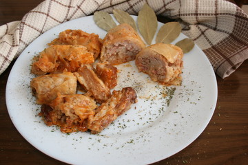 Stuffed cabbage rolls with rice and mushrooms in tomato sauce. Dolma, sarma, or golubtsy - traditional dish of many countries 