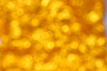 abstract golden bokeh circles for Christmas background.