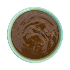 Mushroom soup with beef chunks in a bowl top view isolated on a white background.