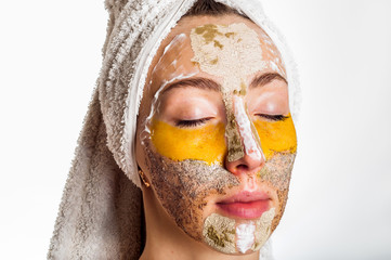 Woman with different masks on her face multi-masking