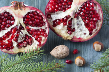 Fresh ripe garnet on wooden table. Top view. Christmas concept. Vintage style