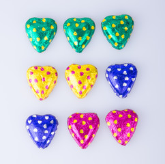 Chocolate or Colorful heart shape chocolate on a background.