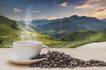 Coffee on wooden table with Rice fields