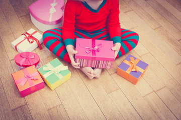 child taking christmas presents