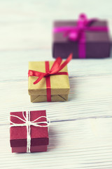 Gift boxes on wooden background, selective focus