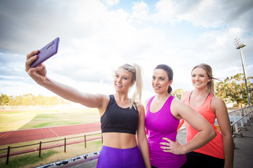 Three fitness women taking a selfie after excersise