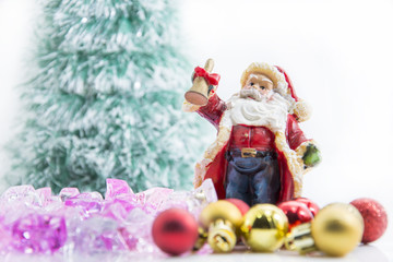 santa claus red and gold ball and blur tree background