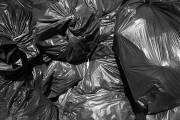 Fototapeta na wymiar A pile of black garbage bags.