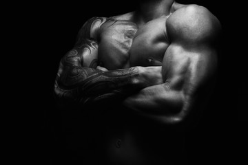 Naklejka premium Strong athletic man showes naked muscular body