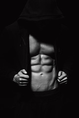 Obraz na płótnie Canvas Strong athletic man showes muscular body